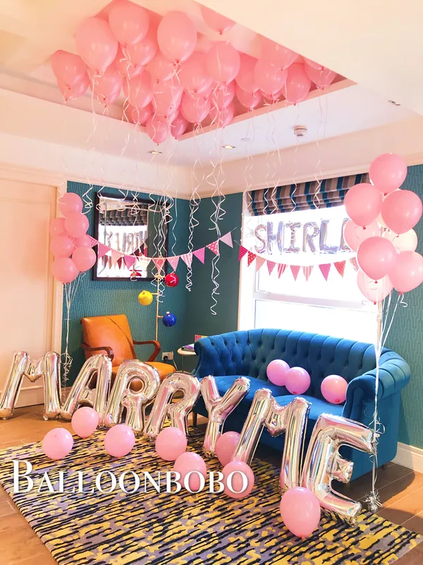 Pale pink MARRY ME proposal on-site decoration
